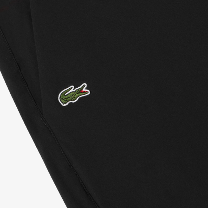 Pantalon Lacoste Stretch noir avec boutons à la taille et aux chevilles