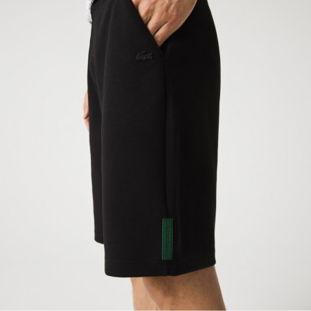 Le Short lacoste en coton mélangé bleu marine est chez DM'Sports !
