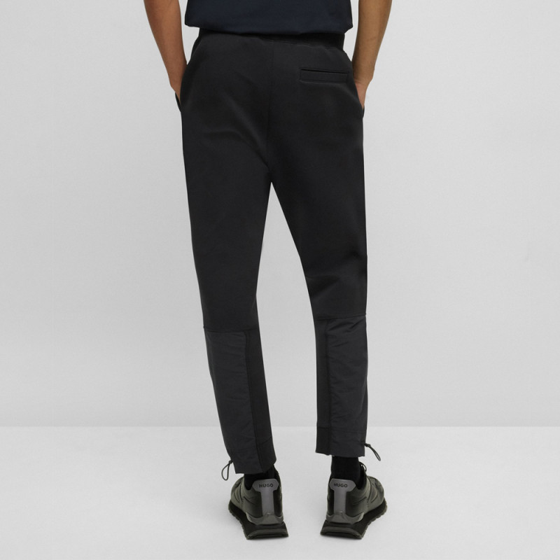 Bas de survêtement en coton mélangé avec logo encadré chez DM'Sports