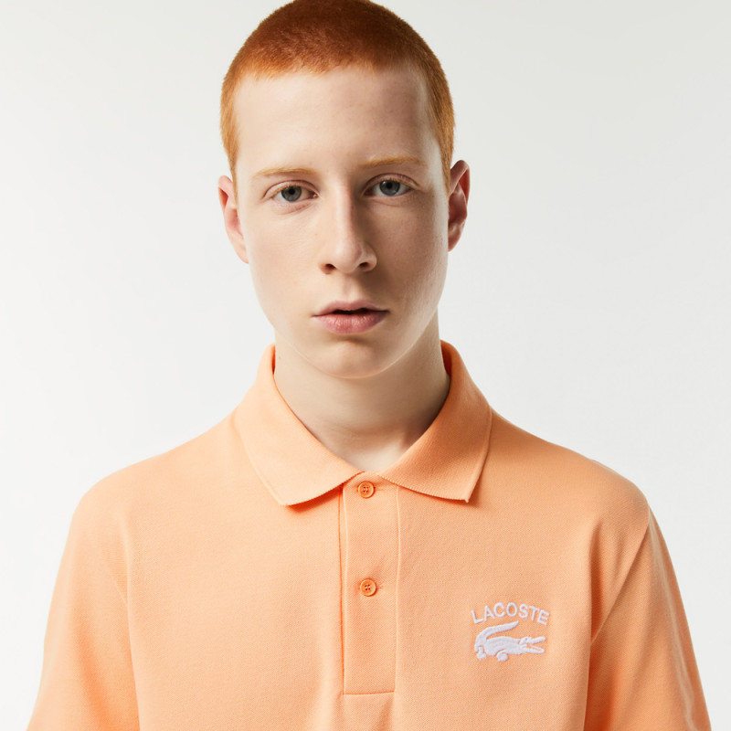 Polo Lacoste orange avec crocodile brodé
