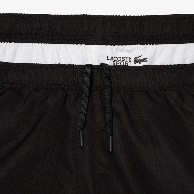 Détail jogging color-block Lacoste