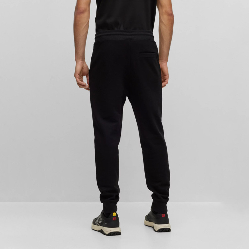 BAS DE SURVÊTEMENT NOIR RESSERRÉ AU BAS DES JAMBES