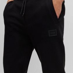 BAS DE SURVÊTEMENT ORNÉ D’UN BADGE LOGO