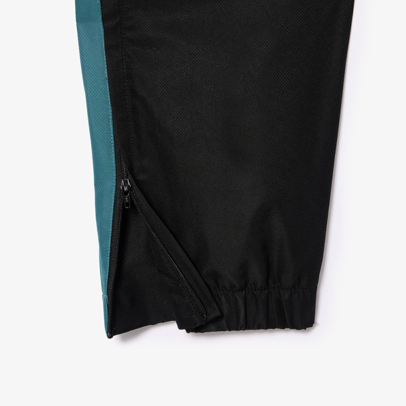 Pantalon de survêtement Lacoste SPORT avec bande Lacoste chez DMS