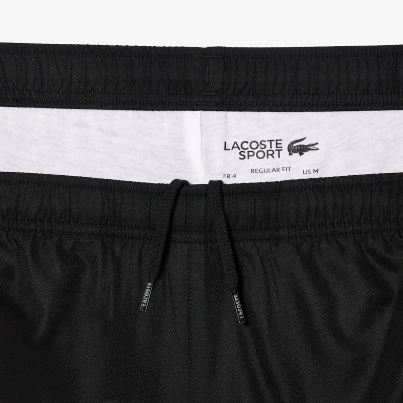 Pantalon de survêtement Lacoste SPORT avec bande Lacoste chez DMS