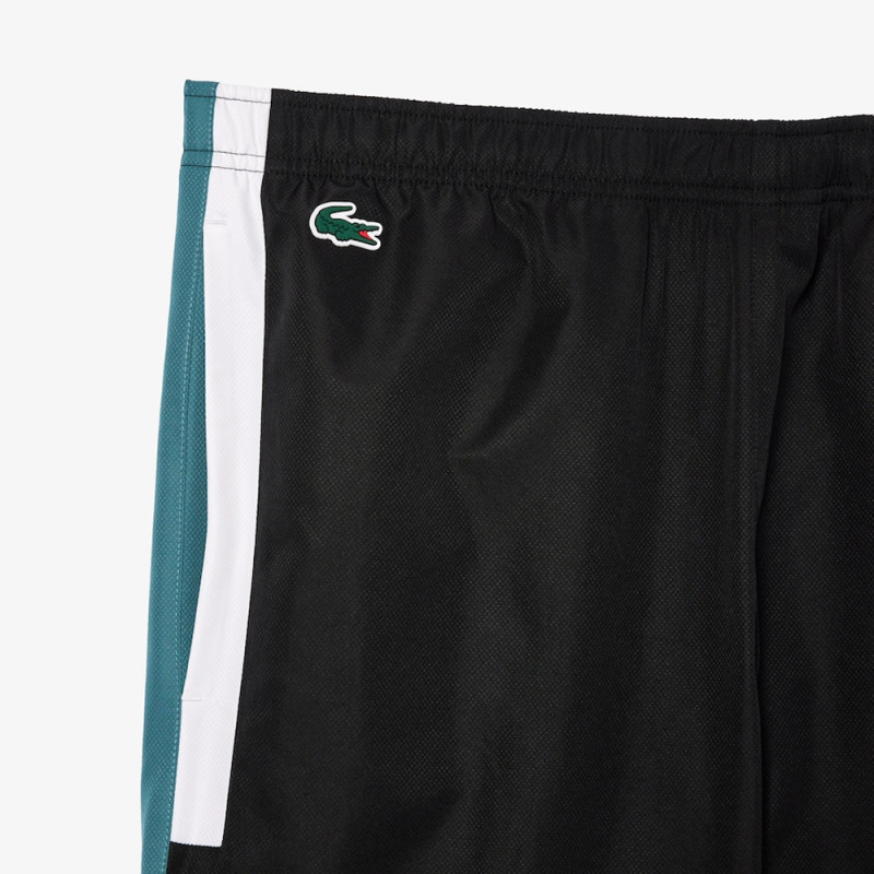 Pantalon de survêtement Lacoste SPORT avec bande Lacoste chez DMS