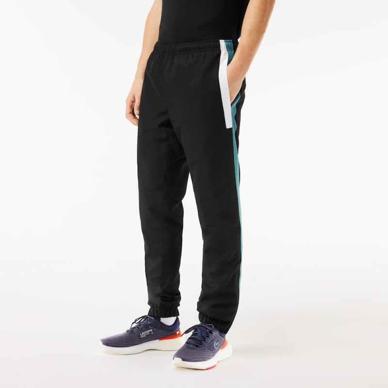 Pantalon de survêtement Lacoste SPORT avec bande Lacoste chez DMS