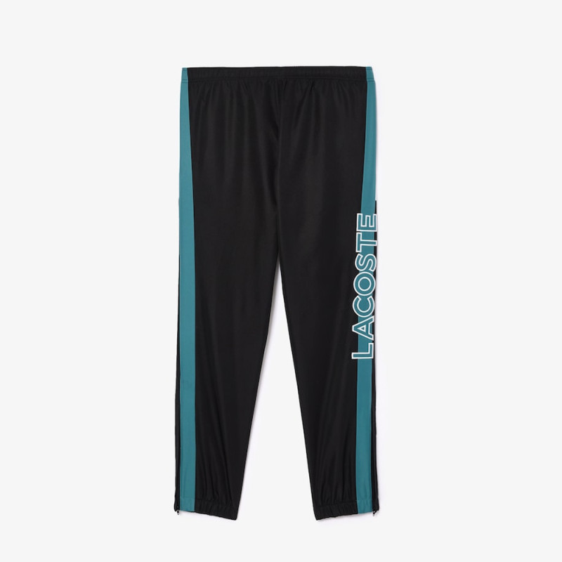 Pantalon de survêtement Lacoste SPORT avec bande Lacoste chez DMS