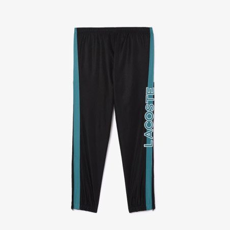 Pantalon de survêtement Lacoste SPORT avec bande Lacoste chez DMS