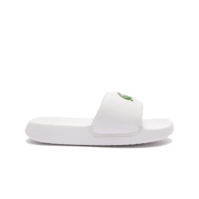 CLAQUETTES LACOSTE SERVE SLIDE 1. ENFANT BLANCHES