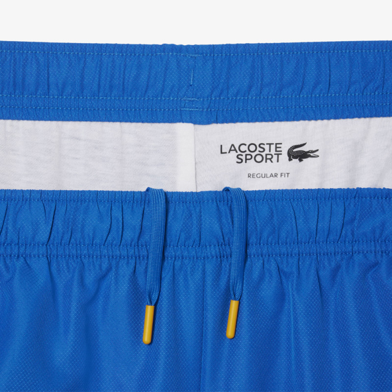 Short Homme Lacoste Tennis – Bleu – Bandes Griffées & Tissu Léger Performant