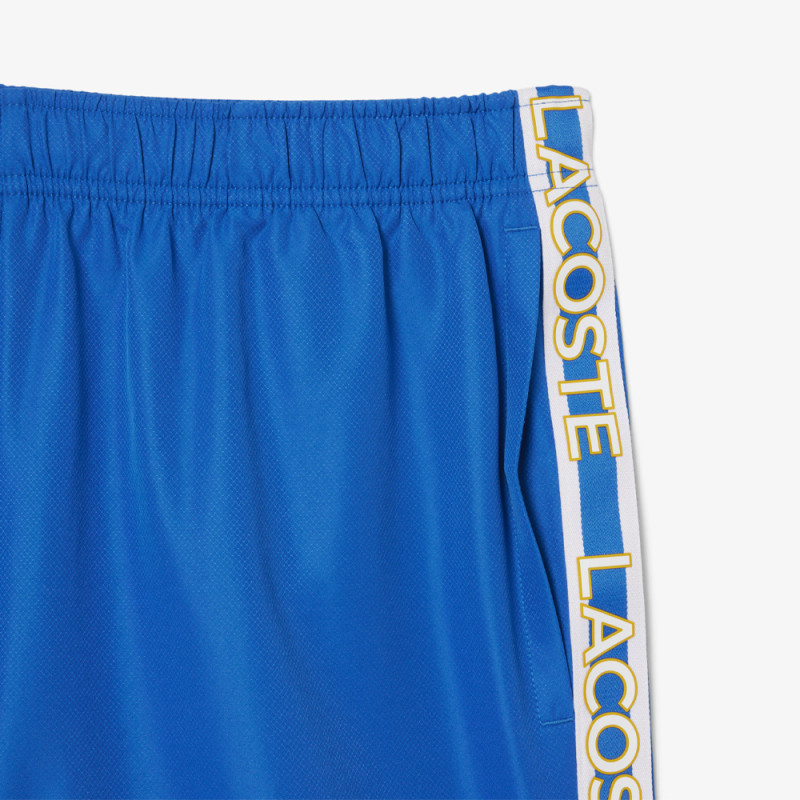Short Homme Lacoste Tennis – Bleu – Bandes Griffées & Tissu Léger Performant