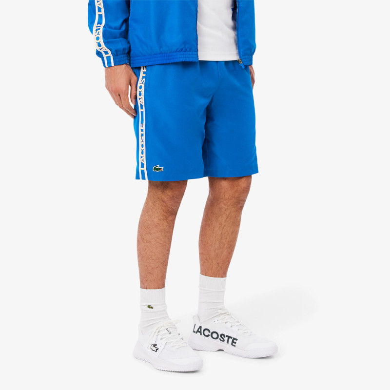 Short Homme Lacoste Tennis – Bleu – Bandes Griffées & Tissu Léger Performant
